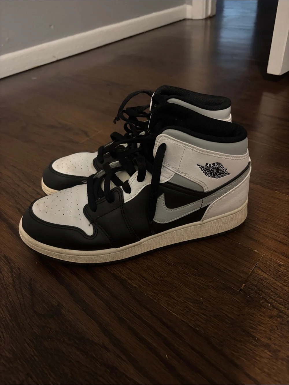 Nike Air Jordan 1 Mid Black and White High-Top Sneakers